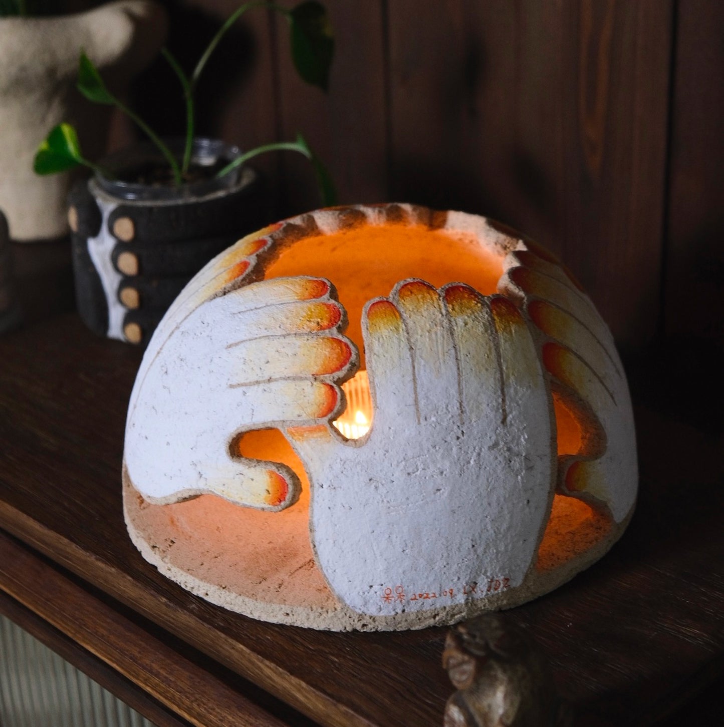 Xin Li: Hand-molded ceramic Candlelight installation